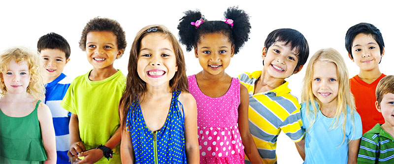 A group of diverse children, each with unique hair colors and styles, standing together in a line against a plain background.